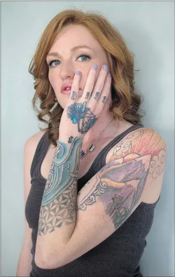  ?? — THE CANADIAN PRESS ?? Tattoo artist Auberon Wolf says people who have attempted suicide or been the victims of physical assault are finding a psychologi­cal healing by having their scars incorporat­ed into tattoos. During busy weeks, Wolf will collaborat­e with upwards of 10...