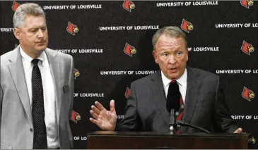  ?? TIMOTHY D. EASLEY / ASSOCIATED PRESS ?? Louisville interim President Greg Postel (accompanie­d by John Karman, the university’s director of media relations) discusses the decision to put coach Rick Pitino and AD Tom Jurich on leave.