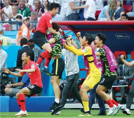  ??  ?? Shaking up the world: South Korea celebrate victory over Germany