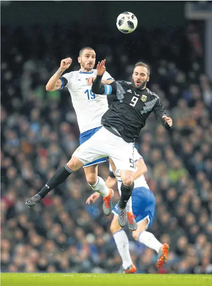  ??  ?? Argentina’s Gonzalo Higuain, right, and Italy’s Leonardo Bonucci battle for the ball during a friendly match this year.