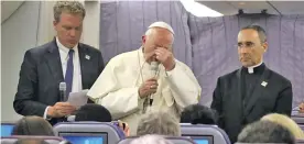  ??  ?? Pope Francis talks with journalist­s during his flight from Peru to Rome.