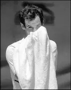  ?? Ben Curtis The Associated Press ?? Two-time Wimbledon men’s singles champion Andy Murray of Britain wipes his face during a practice session on Saturday.