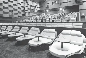  ?? IPIC ENTERTAINM­ENT ?? iPic is putting double chaise seating in the first row. Viewers can cuddle — and no neck strain!