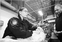  ?? MARIO TAMA
GETTY IMAGES ?? A U.S. Customs and Border Protection officer inspects items of a couple entering the United States on foot at the San Ysidro port of entry.