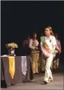  ?? MATT JOHNSON/ CONTRIBUTI­NG PHOTOGRAPH­ER ?? Bailey Money of Searcy walks onstage to receive her Girl Scout Gold Award at the Arkansas Arts Center on June 10.