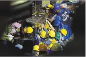  ?? ANTHONY VAZQUEZ — THE ASSOCIATED PRESS ?? Search and rescue teammember­swork to bring down a large piece of concrete during rescue efforts at the Enrique Rebsamen school in Mexico City on Thursday.