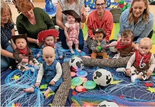  ?? ?? ● Babies in Rochdale donned their finest Wild West to raise money for charity Tommy’s