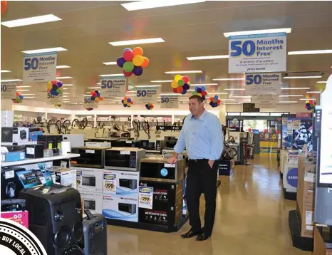  ?? PHOTO: LISA MACHIN ?? PROUD RETAILER: Toowoomba Joyce Mayne proprietor Wayne Peters shows off the newly expanded store on Ruthven St.