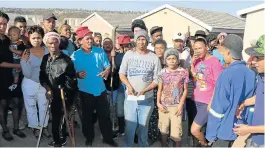  ?? Picture: BHONGO JACOB ?? NO, NO, WE WON’T GO: Fynbos residents have illegally occupied 50 houses.