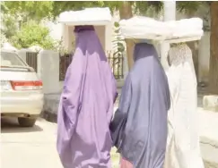  ??  ?? Girls of school age hawking on streets of Kano