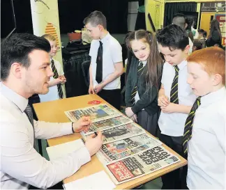  ??  ?? Newsround The Advertiser’s Andrew Bargh speaks with pupils