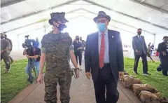  ?? PHOTOS BY LOUIS TUCKER/FOR THE COMMERCIAL APPEAL ?? Marine Lt. Col. Bethany Peterson leads U.S. Rep. Steve Cohen and members of the press around the revamped FEMA vaccinatio­n center site.