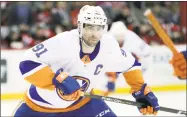  ?? Julio Cortez / Associated Press ?? Islanders center John Tavares skates against the Devils on March 31.