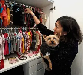  ?? — Reuters ?? Lap of luxury: Man carrying Fun Fun while picking an outfit for her pets. (Right) Man posing with one of her dogs on-board a private jet during the trip to Japan from Hong Kong.