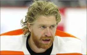  ?? TOM MIHALEK – THE ASSOCIATED PRESS ?? Jake Voracek, seen in a home preseason loss to the Boston Bruins Monday night, won’t be the only Flyers poster boy with flying ginger hair on face and head this season. See that thing below?