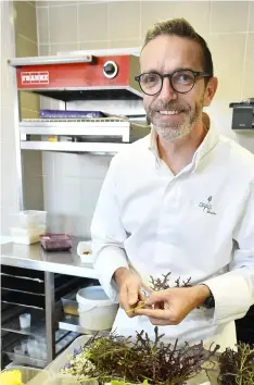  ?? AFP/GETTY IMAGES ?? French chef Sebastien Bras poses as he works in the kitchen of his threestar restaurant Le Suquet, in Laguiole, southern France, on Thursday, after announcing that he asked not to be included in the Michelin Guide starting in 2018.