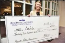  ?? PHOTO PROVIDED ?? Allie Bollman holds the $2,500 prize she won in a business contest at High Point University in North Carolina.