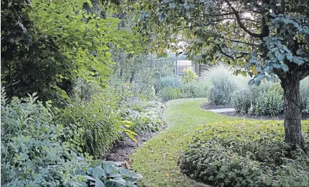  ?? THERESA FORTE, SPECIAL TO THE ST. CATHARINES STANDARD ?? A palette of soft greens, white and violet helps to reinforce feelings of cool and calm in the summer garden.