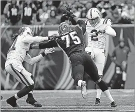  ?? PRESS] [FRANK VICTORES/THE ASSOCIATED ?? The Bengals’ Jordan Willis blocks a punt by the Colts’ Rigoberto Sanchez during Cincinnati’s 24-23 win on Oct. 29. The Bengals’ special teams have also been guilty of shaky play, though.