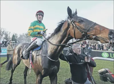  ??  ?? Derek O’Connor and Edwulf after victory in Irish Gold Cup – with the Cheltenham version possibly the next target for the horse.