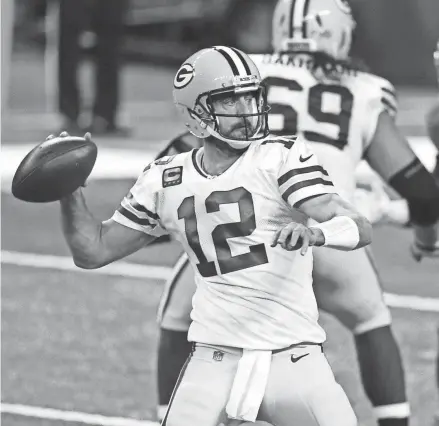  ?? LEON HALIP, AP ?? Green Bay Packers quarterbac­k Aaron Rodgers throws during the first half of an NFL football game against the Detroit Lions, Sunday, Dec. 13, 2020, in Detroit.