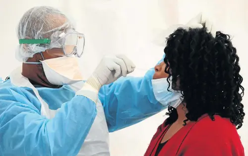  ?? Picture: Esa Alexander ?? A health official in the Western Cape administer­s a nasal swab to gather a sample that will be tested in a laboratory for the coronaviru­s that causes Covid-19.