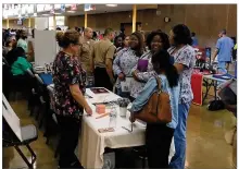  ?? JEREMY P. KELLEY / STAFF ?? Ponitz Career Tech Center students who are certified as dental assistants meet with potential employers at a school job fair in 2019.