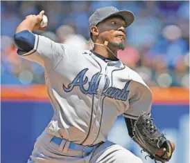  ?? Kathy Willens/AP ?? Atlanta Braves starting pitcher Julio Teheran delivers during the second inning of a baseball game against the New York Mets, Sunday, June 19, 2016, in New York.