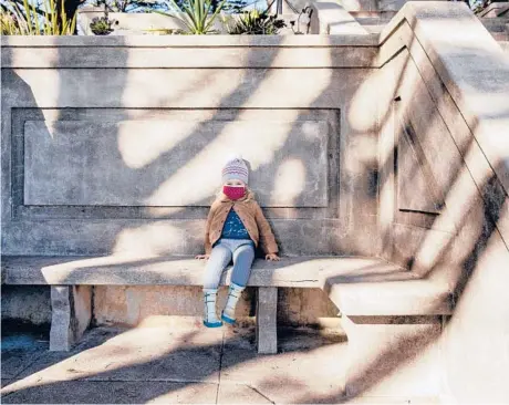  ?? CAYCE CLIFFORD/THE NEWYORKTIM­ES ?? Alice McGraw, 2, sits alone Nov. 25 at the Mount Olympus monument in San Francisco.“Seeing your kid playing on a playground with themselves is just sad,” says one mother. COVID-19 has meant the youngest children can’t go to birthday parties or play dates. Parents are keeping them out of day care amid the pandemic.