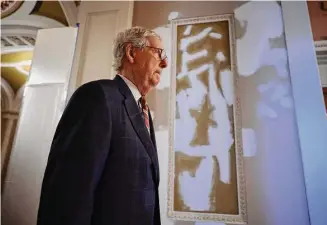  ?? Chip Somodevill­a/Getty Images ?? Senate Minority Leader Mitch McConnell, R-KY, returns to his offices in the U.S. Capitol after delivering a speech on the Senate floor Thursday in Washington, D.C.