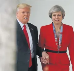  ?? Photograph: Christophe­r Furlong/ Getty Images ?? Prime Minister Theresa May and President Donald Trump walk handin-hand at the White House on Friday