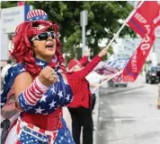  ?? MATIAS J. OCNER mocner@miamiheral­d.com ?? Suzy ‘La Diva for Trump’ Taylor attends a protest at the Freedom Tower on Saturday.