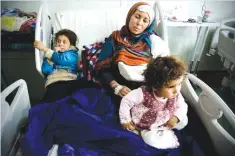  ??  ?? MOSUL: Um Yousef and her two young daughters recover in an Irbil hospital after they were badly injured in a mortar attack outside their home in Mosul. As Iraqi forces secure a series of swift gains, civilian casualties in the Mosul operation are...