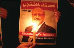  ??  ?? File photo shows a demonstrat­or holds a poster with a picture of Khashoggi outside the Saudi Arabia consulate in Istanbul. — Reuters photo