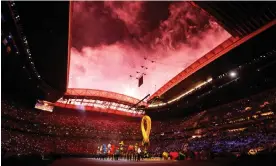  ?? Tom Jenkins/The Guardian ?? Performers inside the stadium during the opening ceremony, underneath an impressive sky Photograph: