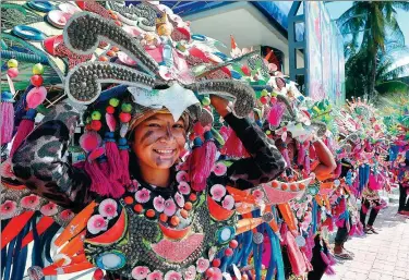  ?? ROUELLE UMALI / XINHUA ?? Performers in traditiona­l costumes welcome tourists at the reopening ceremony of Boracay Island, a tourist attraction in the Philippine­s, in October, after the island underwent a six-month cleanup.