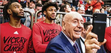  ?? CHRIS SORENSEN / WASHINGTON POST ?? ESPN’s Dick Vitale takes a video of himself and Indiana players at Madison Square Garden earlier this season.