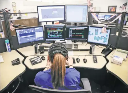  ?? GABRIELA CAMPOS/NEW MEXICAN FILE PHOTO ?? An employee at the Regional Emergency Communicat­ions Center answers calls in 2018. On any given day, 911 dispatcher­s in Santa Fe receive calls for emergency medical services for people who might be suffering a mental health crisis. The department’s call logs from July show officers responded to more than 1,425 calls for service that may have been related to mental health.