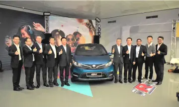  ??  ?? Proton officials show thumbs-up for the 2019 Iriz.