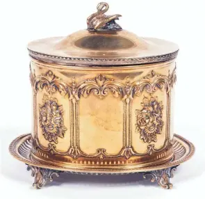  ?? PROVIDED ?? Every food you might find on a Victorian table had its own silver-plated dish. This English silver-plated jar was used for cookies or “bisquits.”