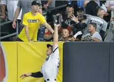  ?? Abbie Parr/Getty Images ?? Yankees right fielder Aaron Judge prevents a home run in the sixth inning against the Indians.