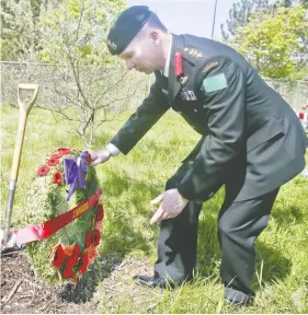  ?? VERONICA HENRI / POSTMEDIA NEWS FILES ?? Col. Daniel Stepaniuk — placing a wreath next to a tree in 2018 — recently told reserve regiments under his charge to cancel any “church parades.”