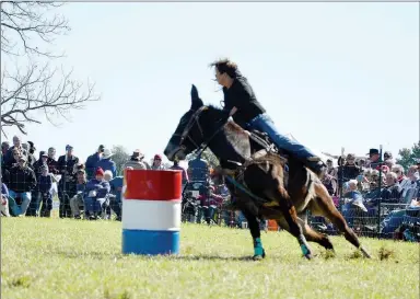  ?? TIMES photograph­s by Annette Beard ?? Becki Sams and Magic Man came in first in the adult division of the barrel race with a time of 18.37. Sams, of Vinita, Okla., and her daughter, Maranda Stites of Pea Ridge, were top competitor­s in the speed events with Stites coming in second on Roster with a time of 18.66 in the barrel race.