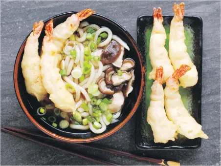  ??  ?? Tempura udon is made by serving brothy noodles with crisp and yummy tempura prawns.