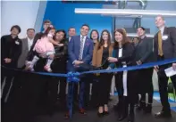  ??  ?? LEFT: Gads Hill Center, 4255 S. Archer Ave., moved its flagship location to Brighton Park to serve a community most in need. RIGHT: Maricela García, CEO of Gads Hill Center, cuts the ribbon to celebrate the grand opening of its new facility.