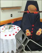  ??  ?? A special table is always laid out inside the legion to honour those men and women who do not return from service.