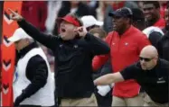  ?? JOHN BAZEMORE THE ASSOCIATED PRESS ?? In this Saturday, Nov. 24, 2018, file photo, Georgia head coach Kirby Smart, left, is restrained by an assistant coach as he yells to his players from the sideline during the second half an NCAA college football game against Georgia Tech, in Athens, Ga. Smart and his fourth-ranked Bulldogs are preparing to face what he calls “one of the most elite group of skill players I’ve seen assembled in college football.”