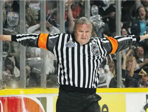  ?? DAVE SANDFORD/GETTY IMAGES. ?? Regina-born Mick Mcgeough, shown refereeing in the 2006 Stanley Cup final, died late Friday night at age 62.