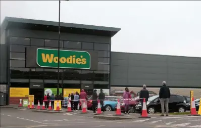  ??  ?? The queue outside Woodie’s in Wexford on Monday morning.