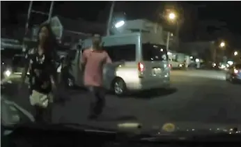  ??  ?? OUT OF CONTROL: Footage from the vehicle of Suthep Pochanasom­boon shows a group of teenagers aggressive­ly approachin­g his car before he shot one of the them dead last month in Chon Buri.